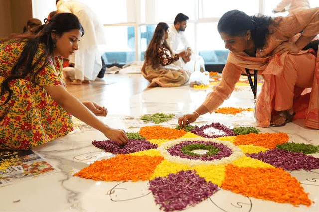 Colleagues making a rangoli